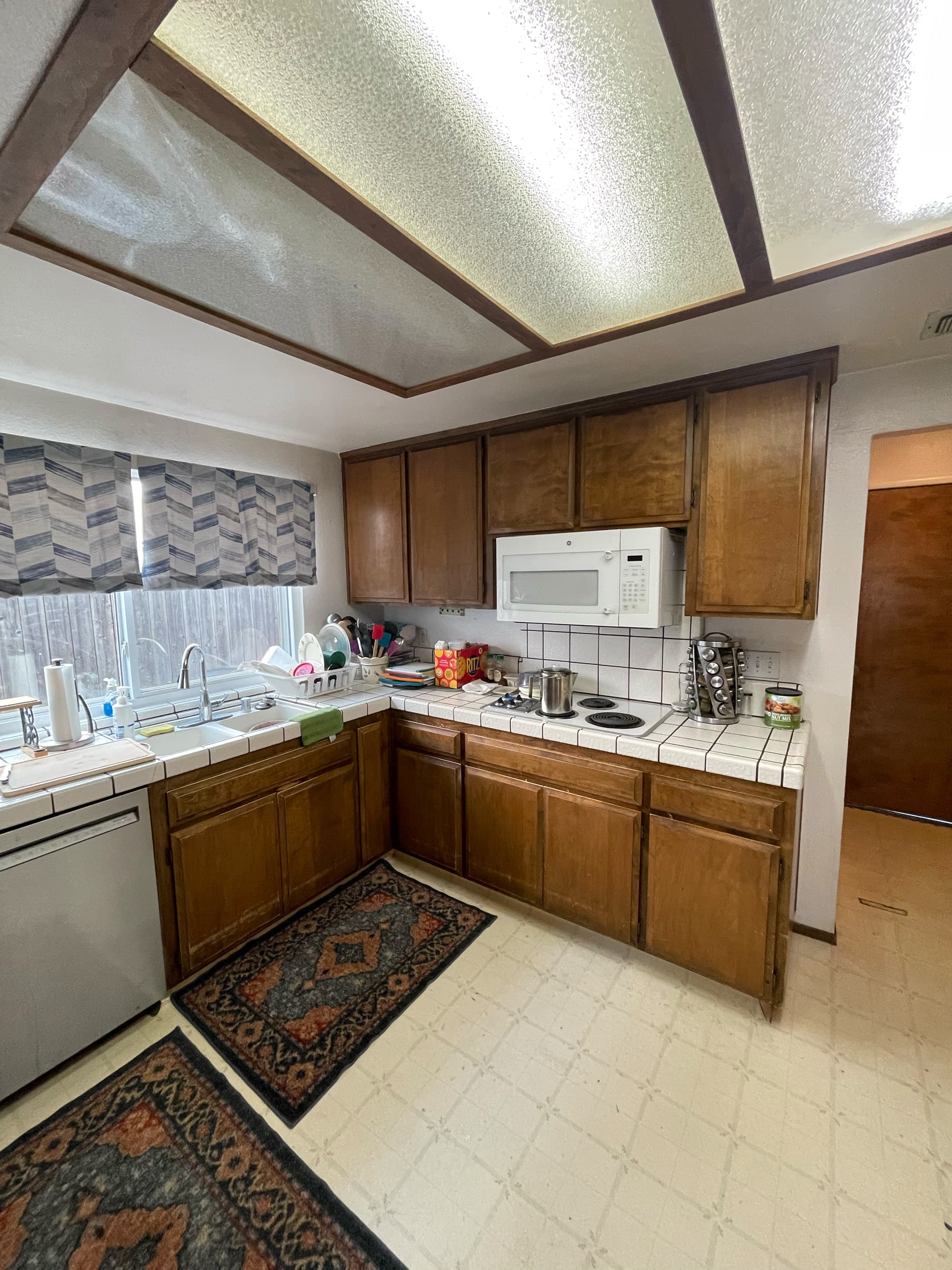 Cherry cabinetry island with quartz countertops